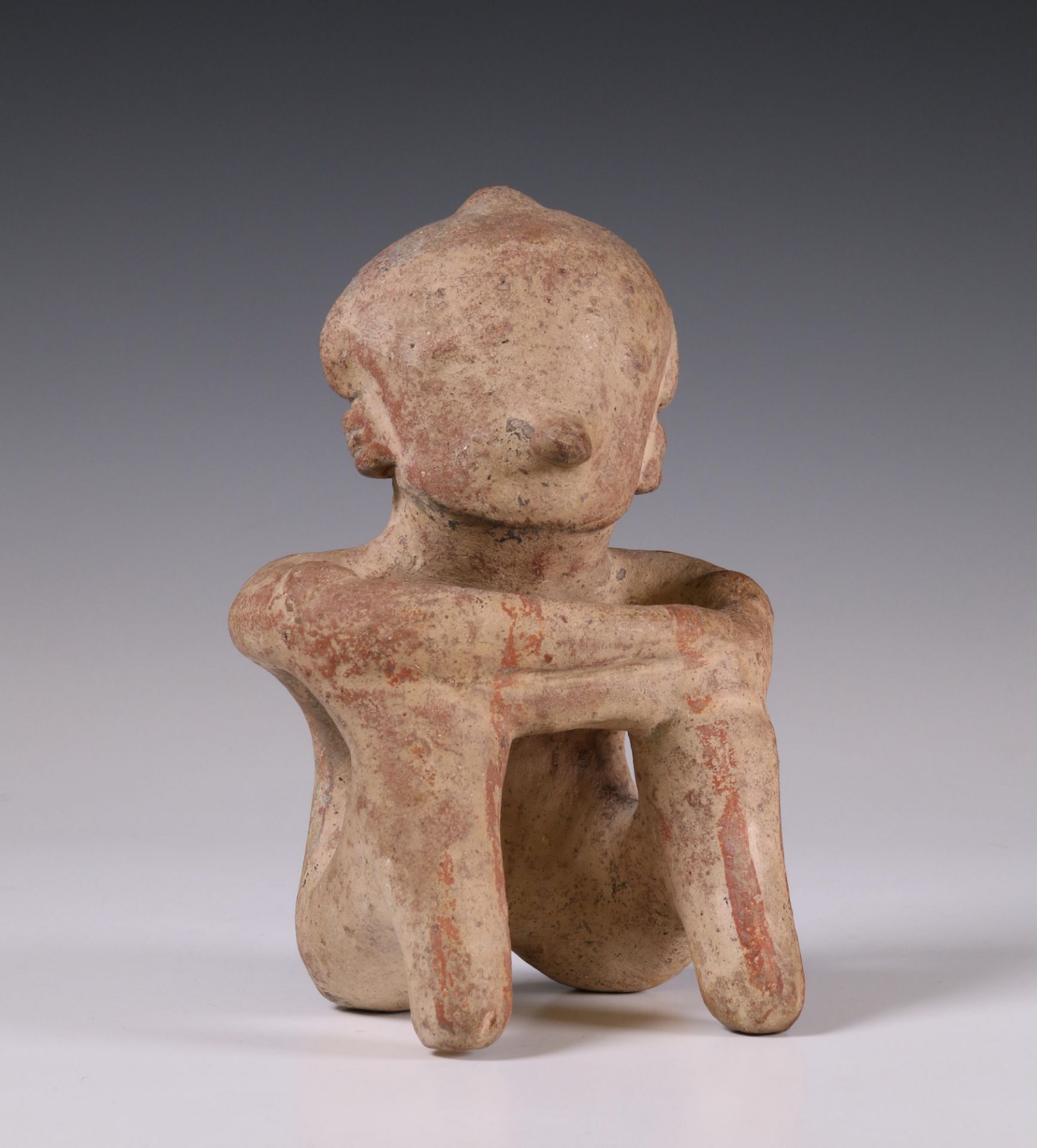 West-Mexico, Nayarit, terracotta seated figure with crossed arms in Chinesco style, 200 BC - 100 AD.