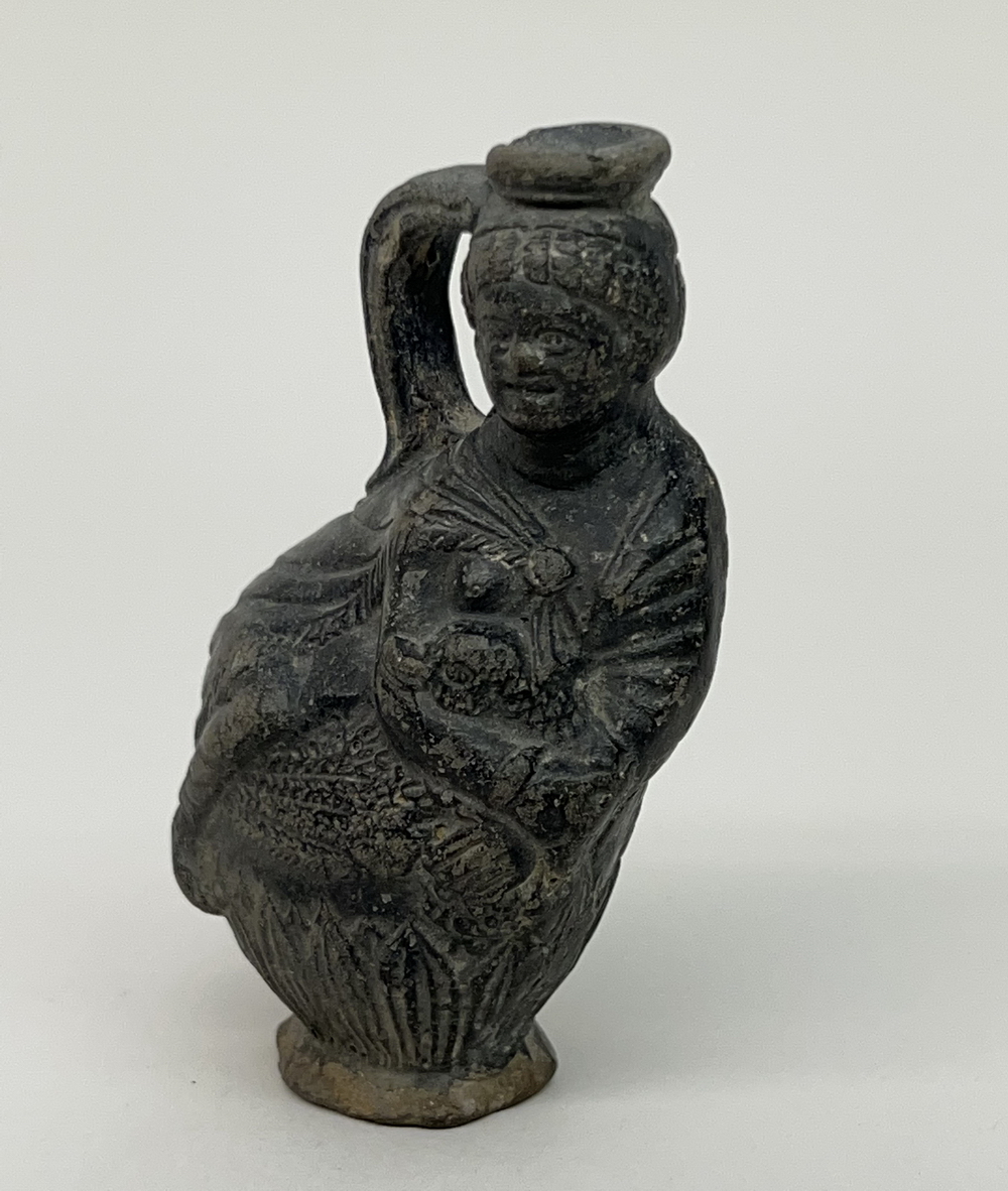 Egypt, black earthenware figure flask, Ptolemaic, 1st century BC - 1st AD.,