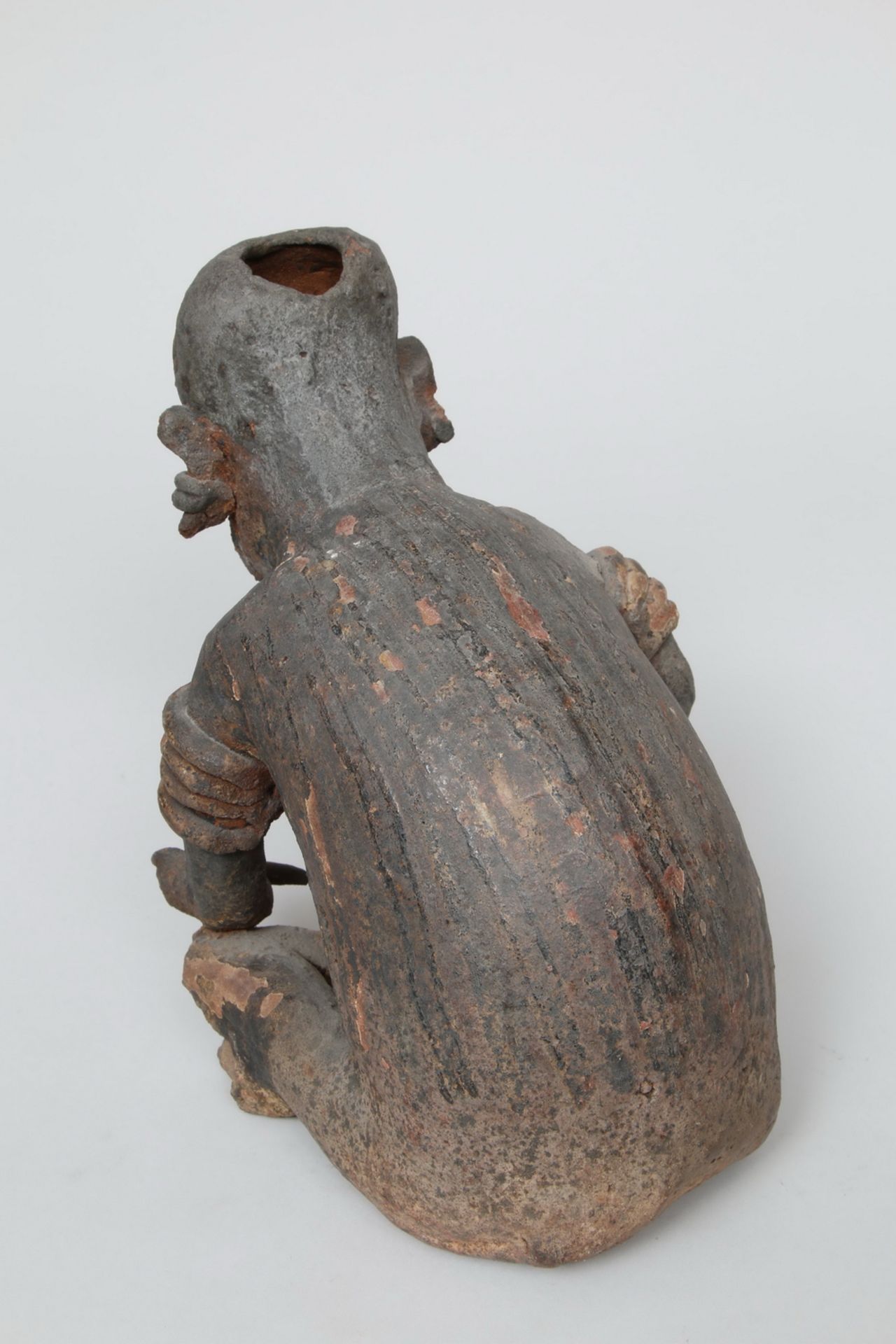 Mexico, Jalisco, a large terracotta seated figure with bent back, 1st BC - 2nd century AD, - Image 2 of 3