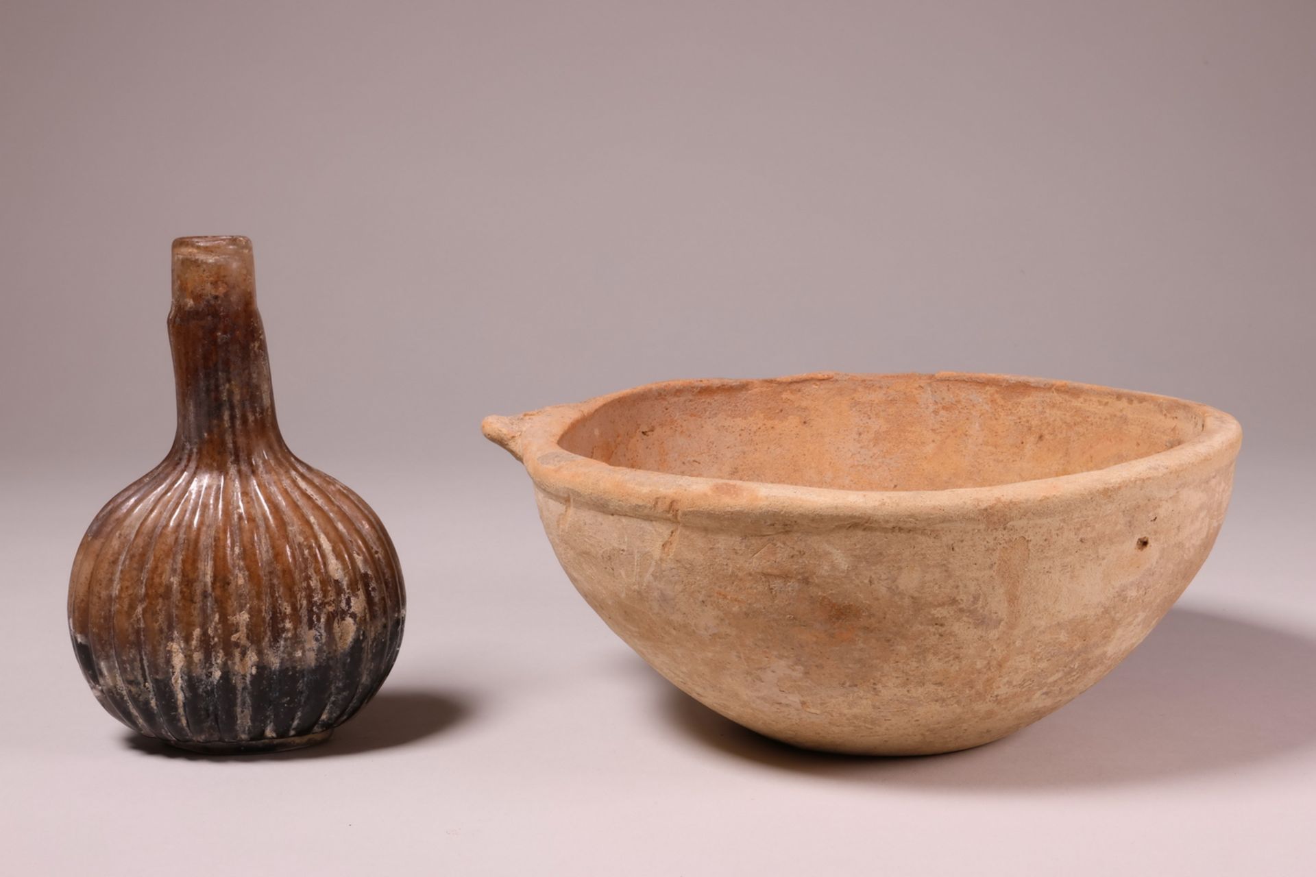 An antique terracotta bowl, possibly Roman and an antique glass flacon - Image 2 of 4
