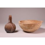 An antique terracotta bowl, possibly Roman and an antique glass flacon