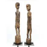 East Timor, pair of ancestor figures, Ai tos. Circular eyes, hands on the hips.