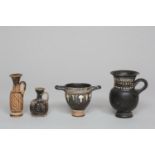 A Greek, Gnathia, blackware skyphos and an oinochoe, 4th century BC and two Apulian small lekythos,
