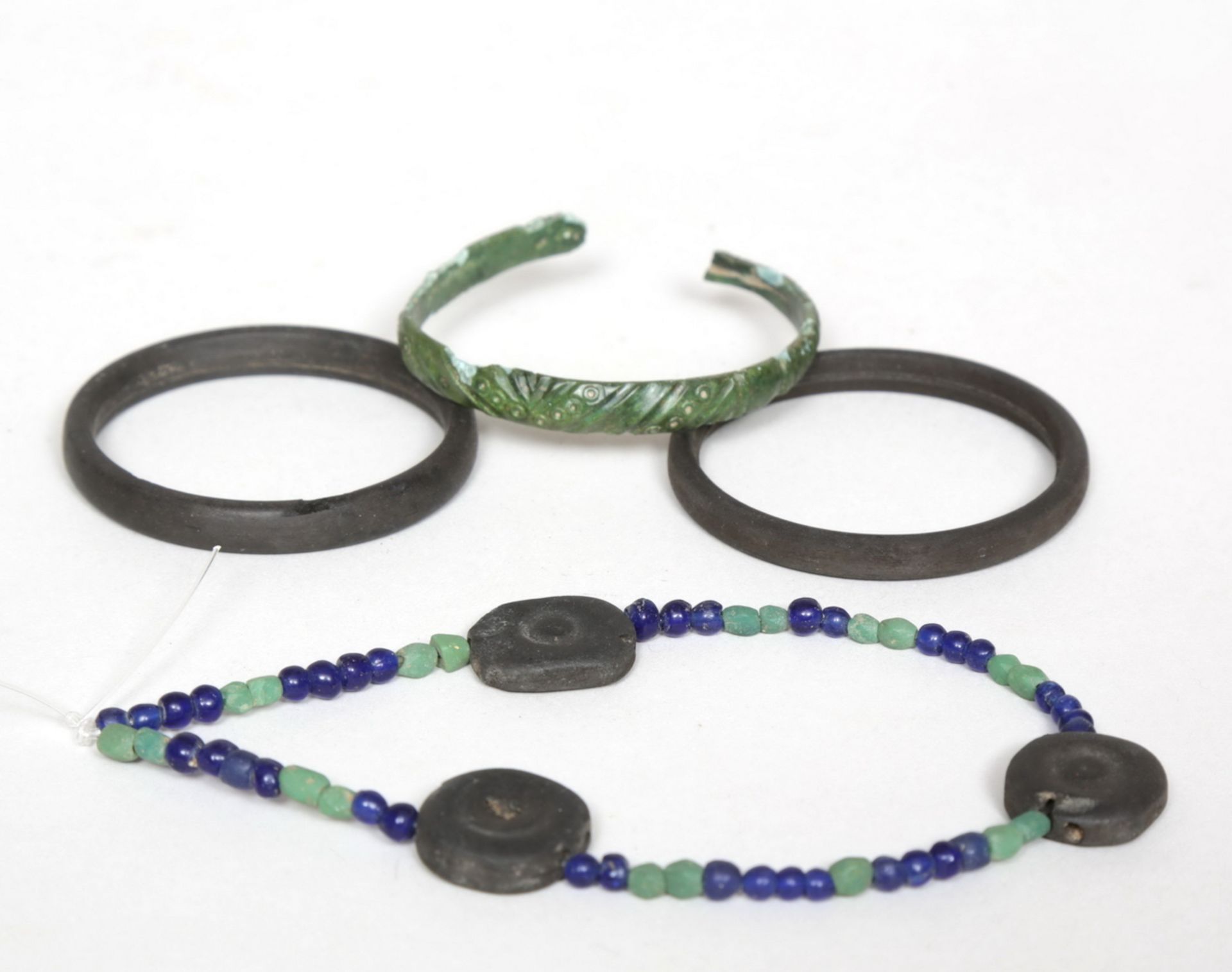 Roman, two black jet bracelets, a bronze bracelet and a beaded bracelet with three black jet beads a - Image 2 of 2