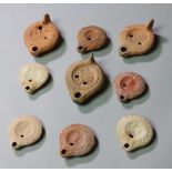 Nine Roman oil lamps, 3rd century AD.