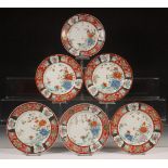 Japan, set van twaalf Kutani porseleinen borden, Meiji periode (1868-1912),