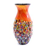 Colored glass vase with rough floral outer wall