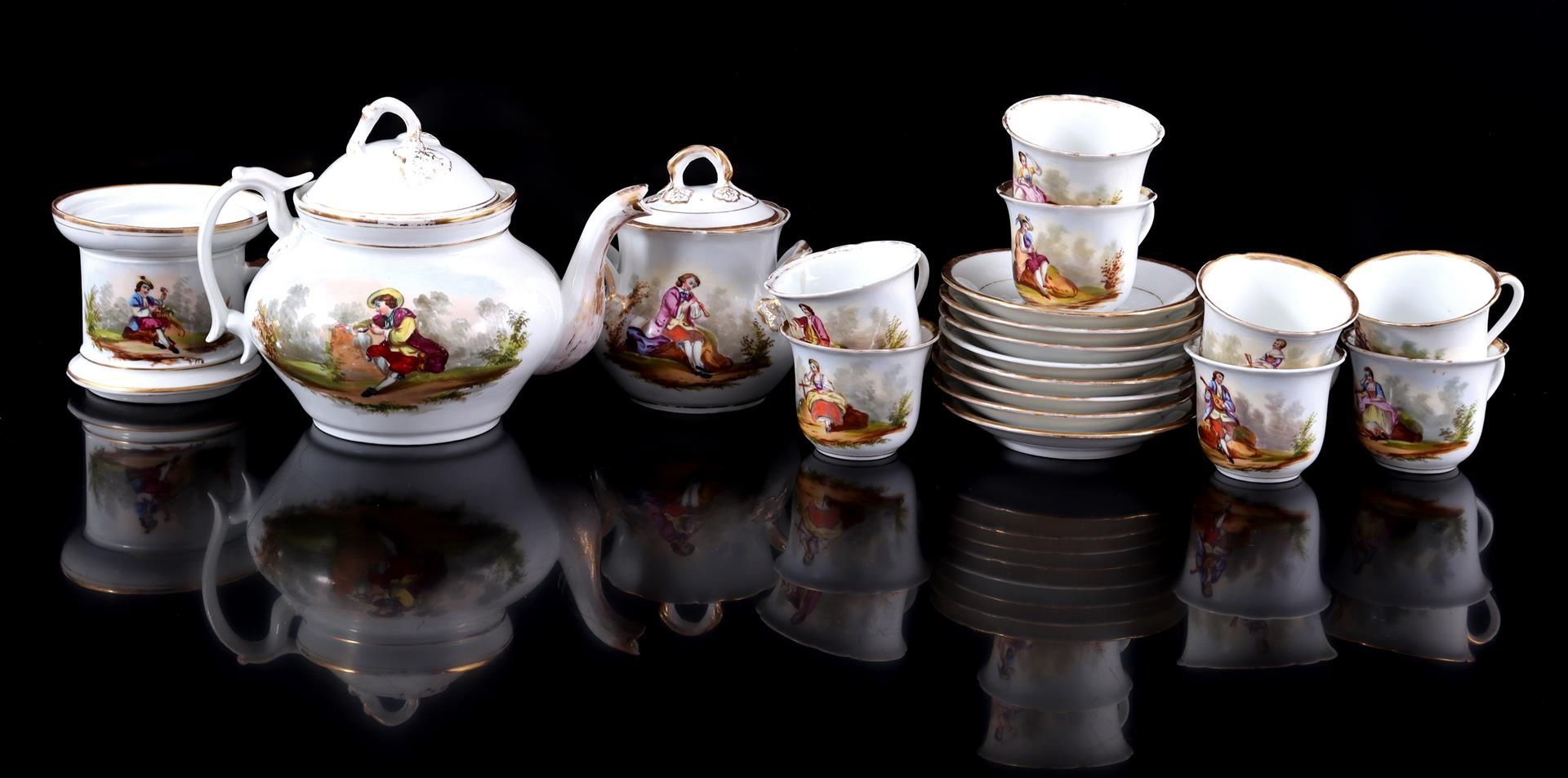 11-piece porcelain tea set with gold accents and various decors