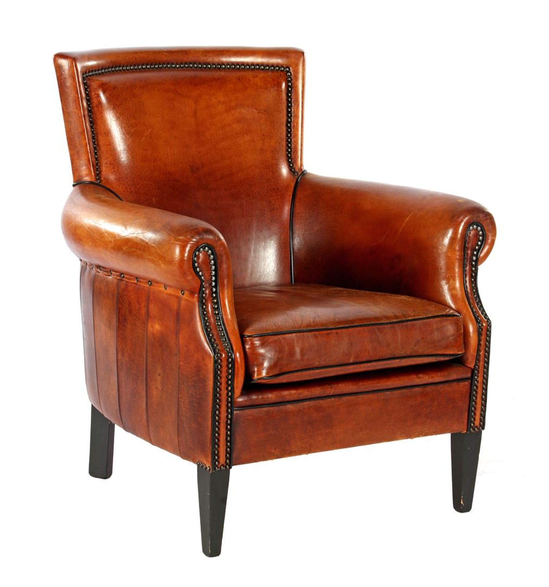Leather armchair with black edges and copper tacks finished