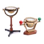 Brass ship's compass on walnut base with gimbal suspension