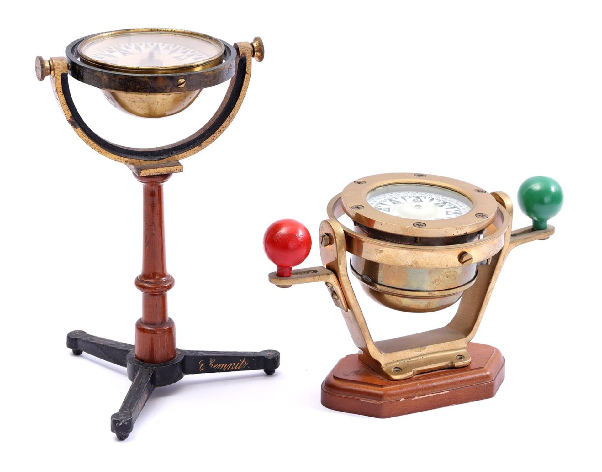 Brass ship's compass on walnut base with gimbal suspension