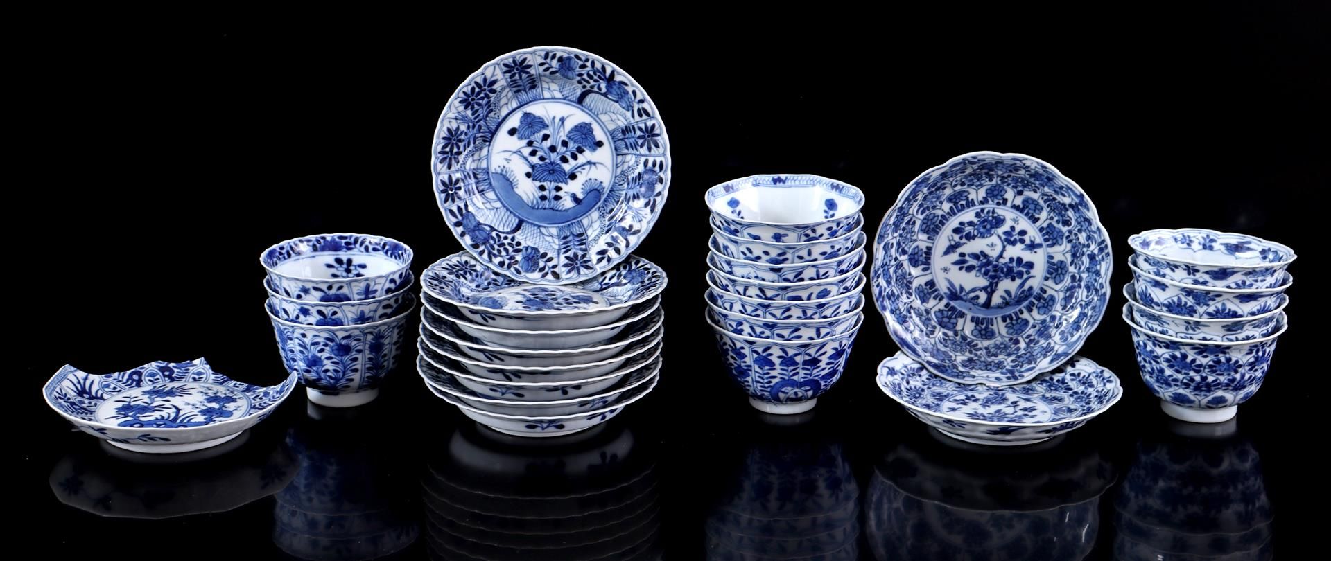 Lot of porcelain cups and saucers with blue and white floral decor