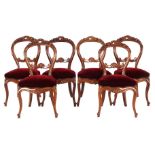 6 mahogany English dining room chairs with a dusted crest and red velvet upholstered seat