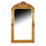 Faceted mirror in a classic gold-coloured richly carved frame with crest