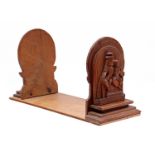 Wooden bookend with a carved scene