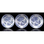 3 porcelain dishes with blue and white floral decor of peonies