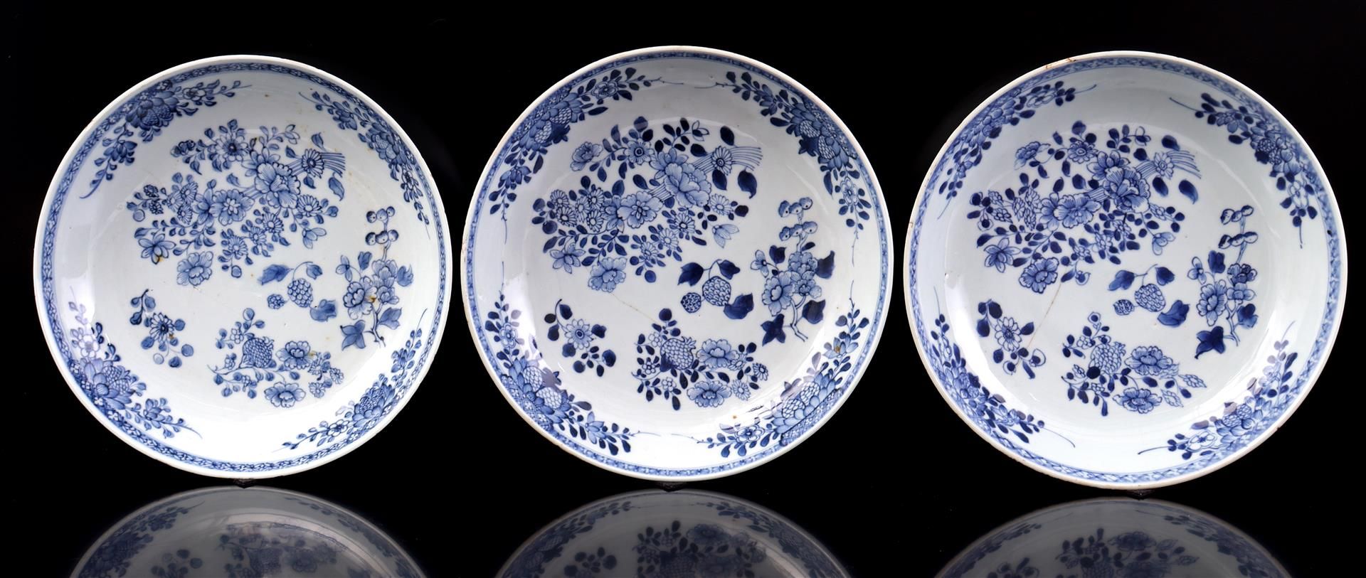 3 porcelain dishes with blue and white floral decor of peonies