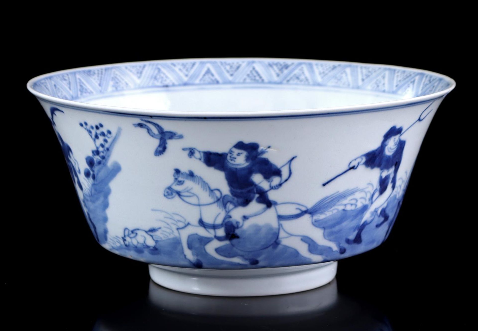 Porcelain bowl with blue and white decor of a house in a mountain landscape 
