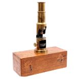 Brass travel microscope in wooden box