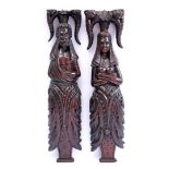 2 oak decorated wall decorations of man and woman