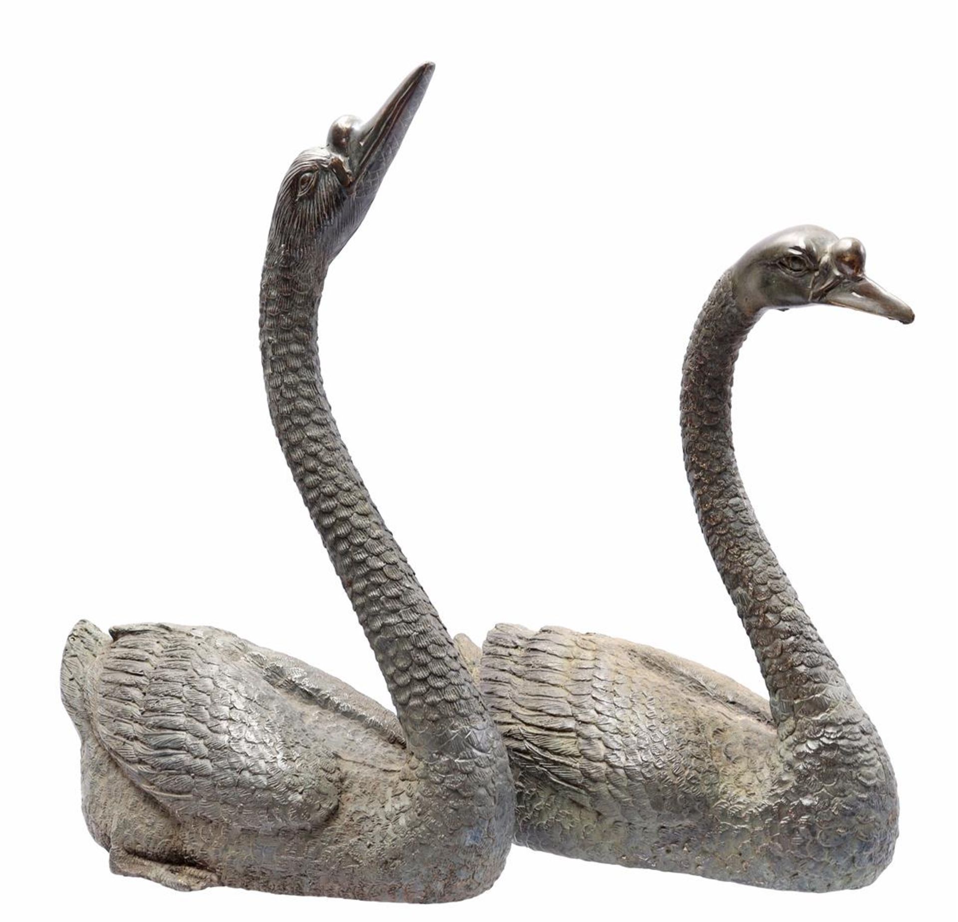 2 bronze hollow statues of swans