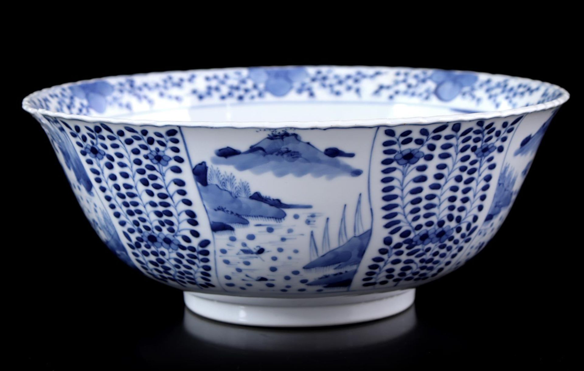 Porcelain bowl with blue decor of landscapes and floral motifs