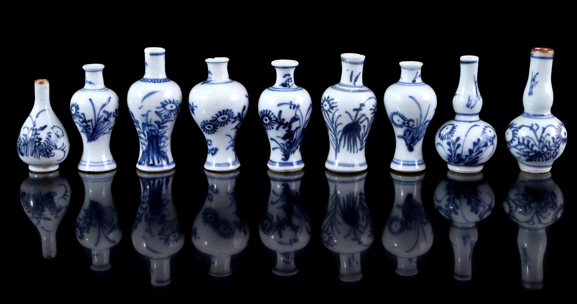 9 porcelain miniature vases with blue and white decor