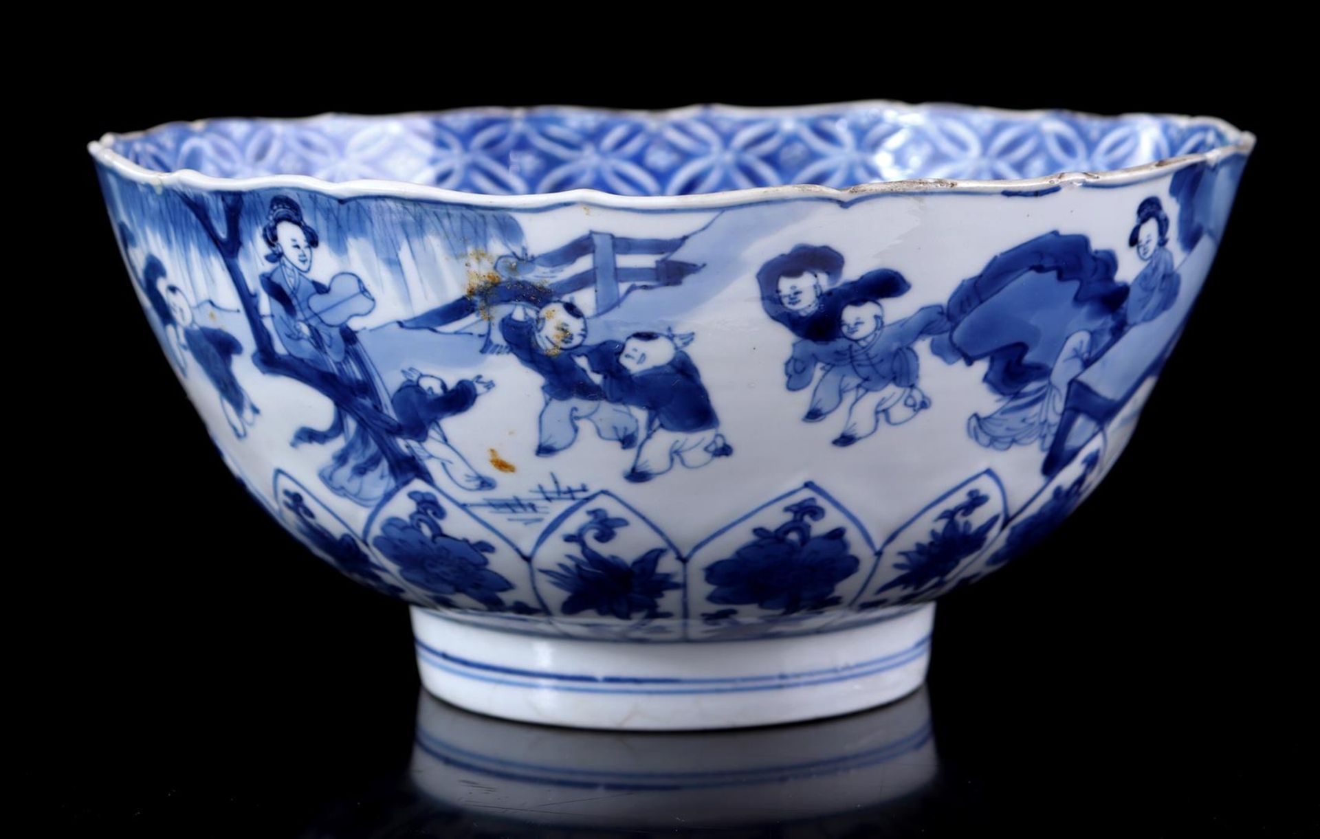 Porcelain bowl with decoration of long lines and fools in a garden