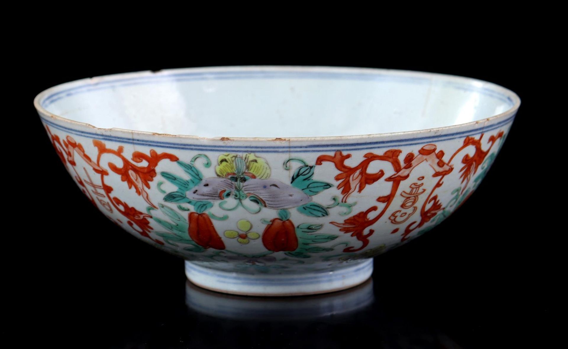 Porcelain bowl with polychrome floral decoration, butterflies and signs