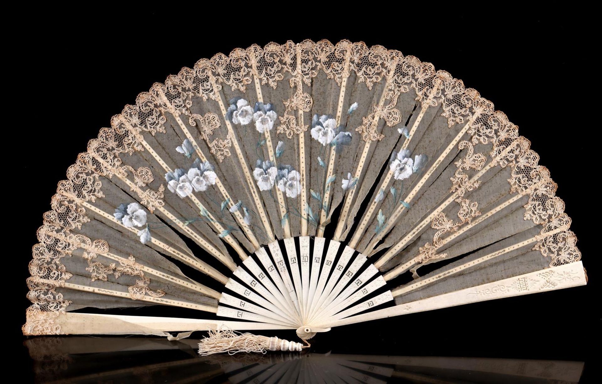 Ivory fan with carving, fabric painted with floral decor and finished with lace