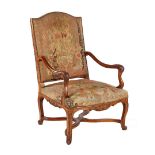 Classic walnut armchair with carved frame and with embroidered upholstery