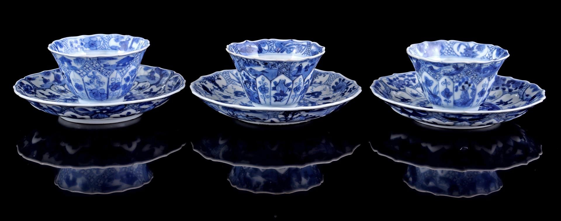 3 porcelain cups and saucers with a contoured rim and a curved surface