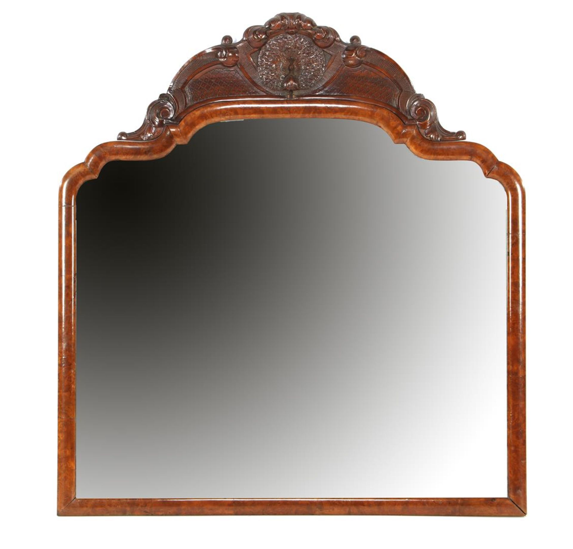 Faceted Soester mirror in burr walnut veneer frame with decorated crest