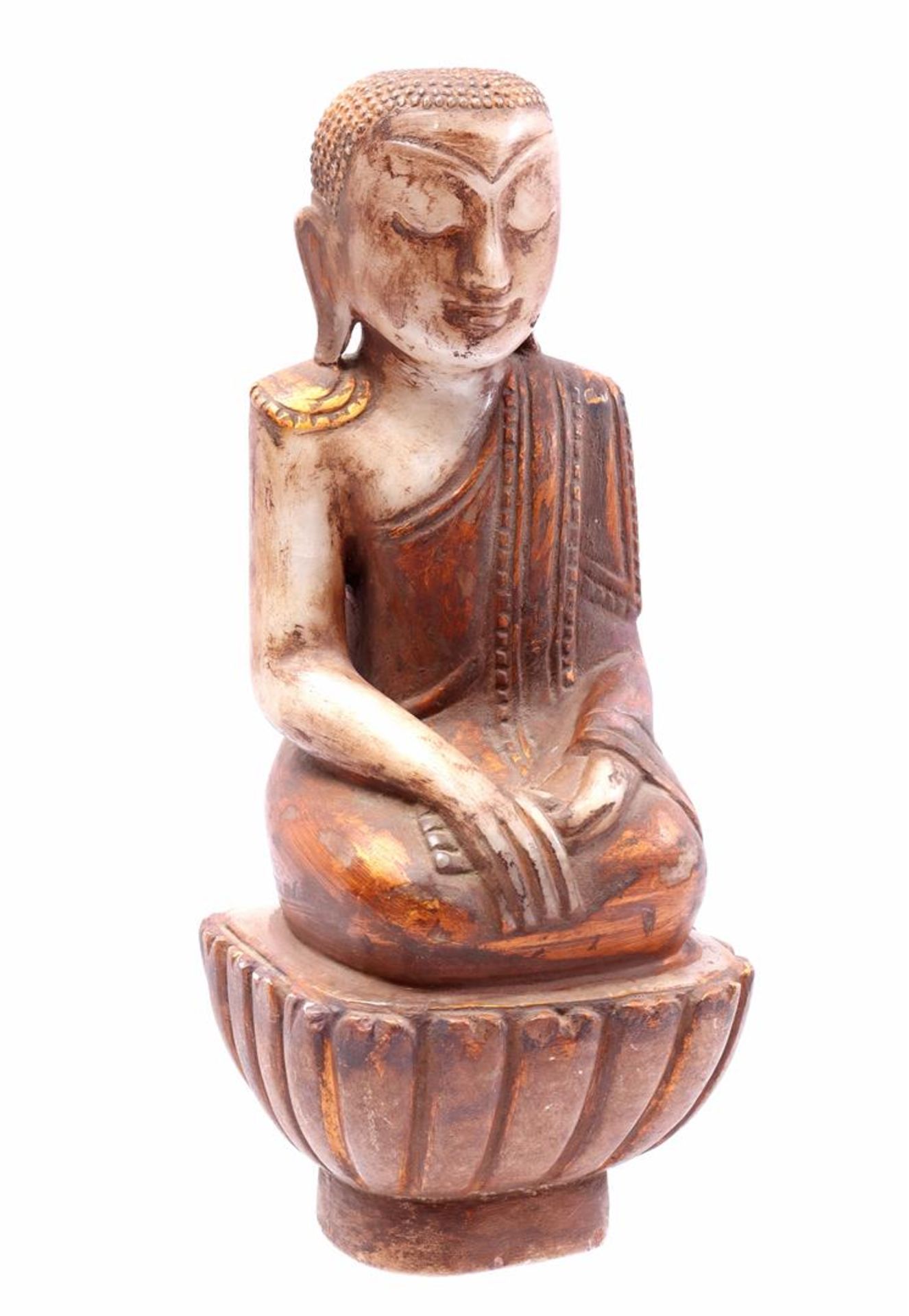 Natural stone statue of a seated Buddha 