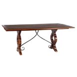 Spanish oak table with folding leaves and wrought iron leg connection and fittings
