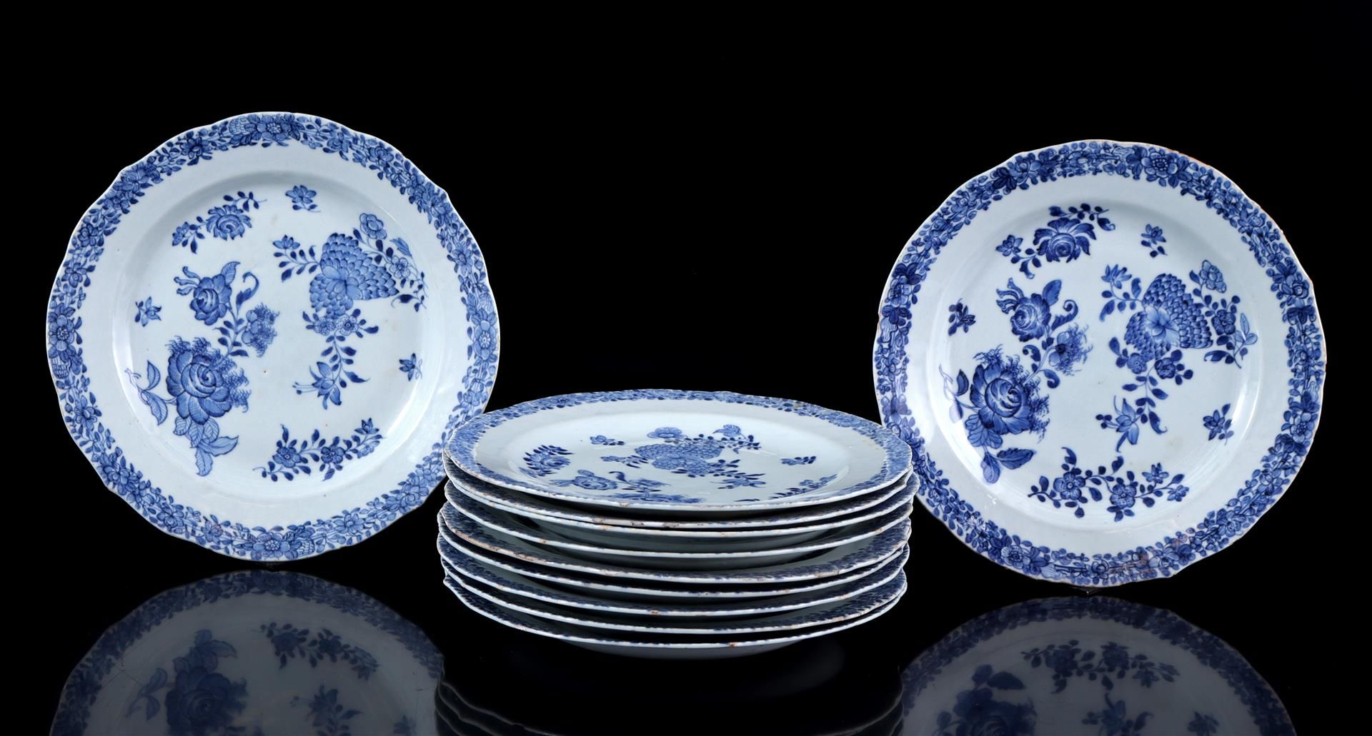 11 porcelain dishes with blue floral decor, China, ca. 1800