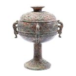 Bronze wine mortar with richly carved decoration and 4 handles