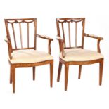 2 elm armchairs with upholstered seat and armrests and tacked edges