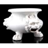 Glazed white earthenware spittoon with lion masks