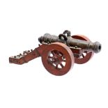 Bronze table gun in wooden gun carriage