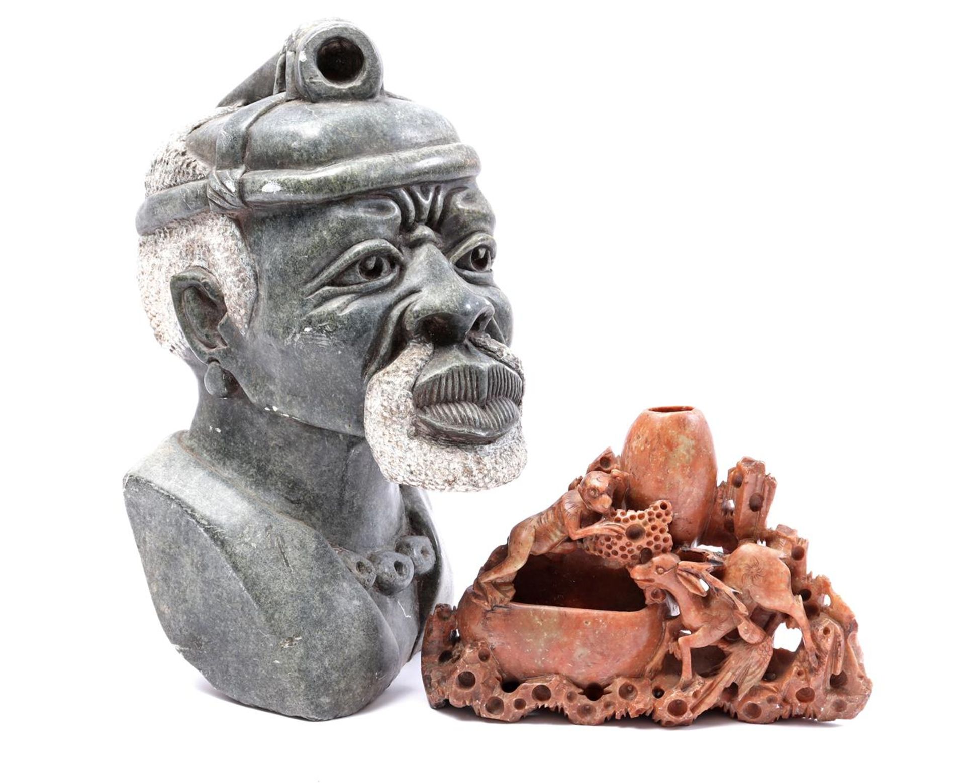 Serpentine head and soapstone object