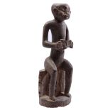 Wooden ceremonial statue, Man with bird