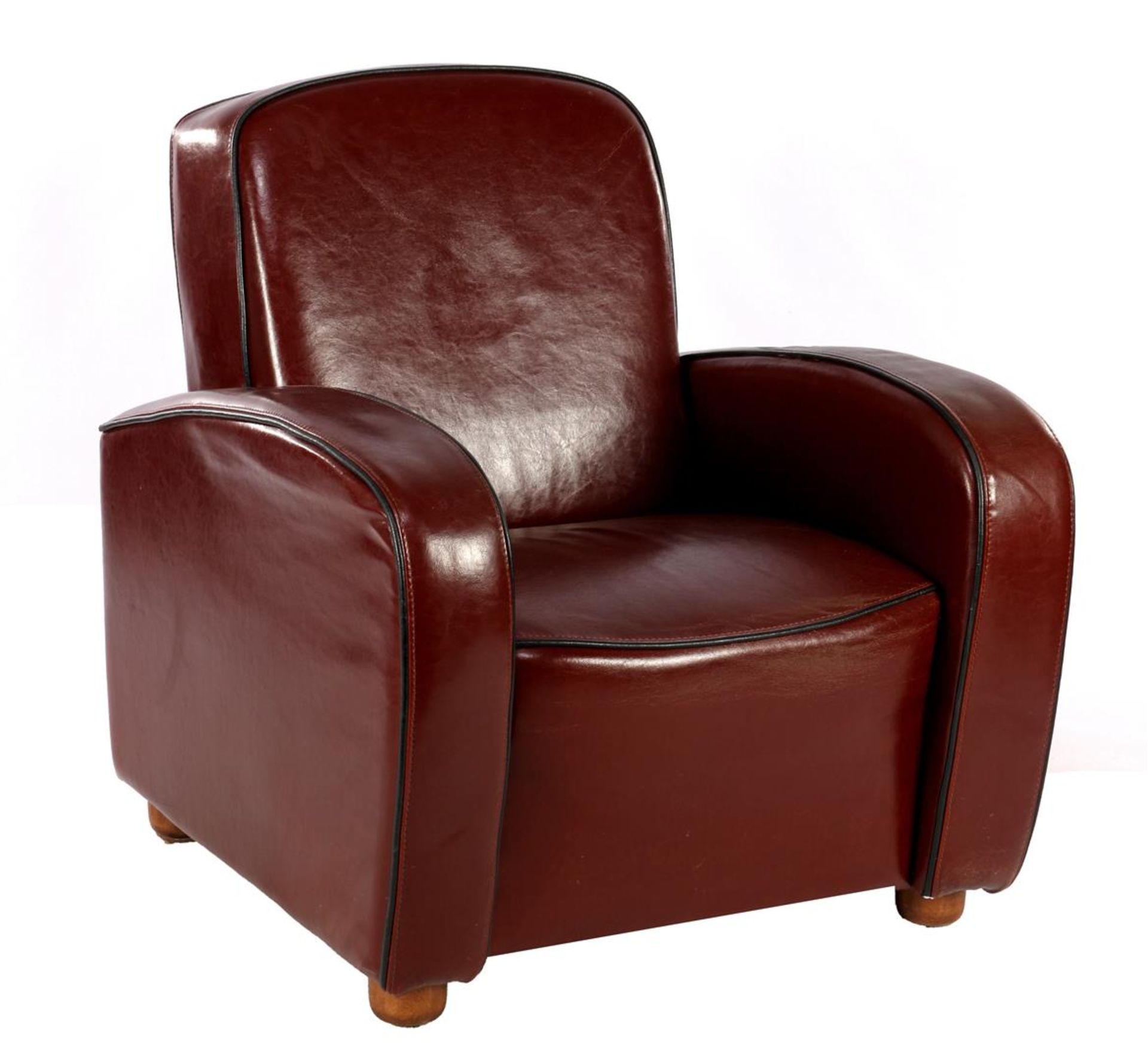 Brown leather armchair with black edges
