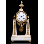 Empire marble column mantel clock with brass case