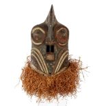 Wooden ceremonial mask with flax