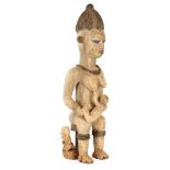 Wooden fertility statue of a woman with 2 children