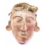 Earthenware mask of figure with reptile on head