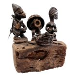 Wooden ceremonial statue with block with figures