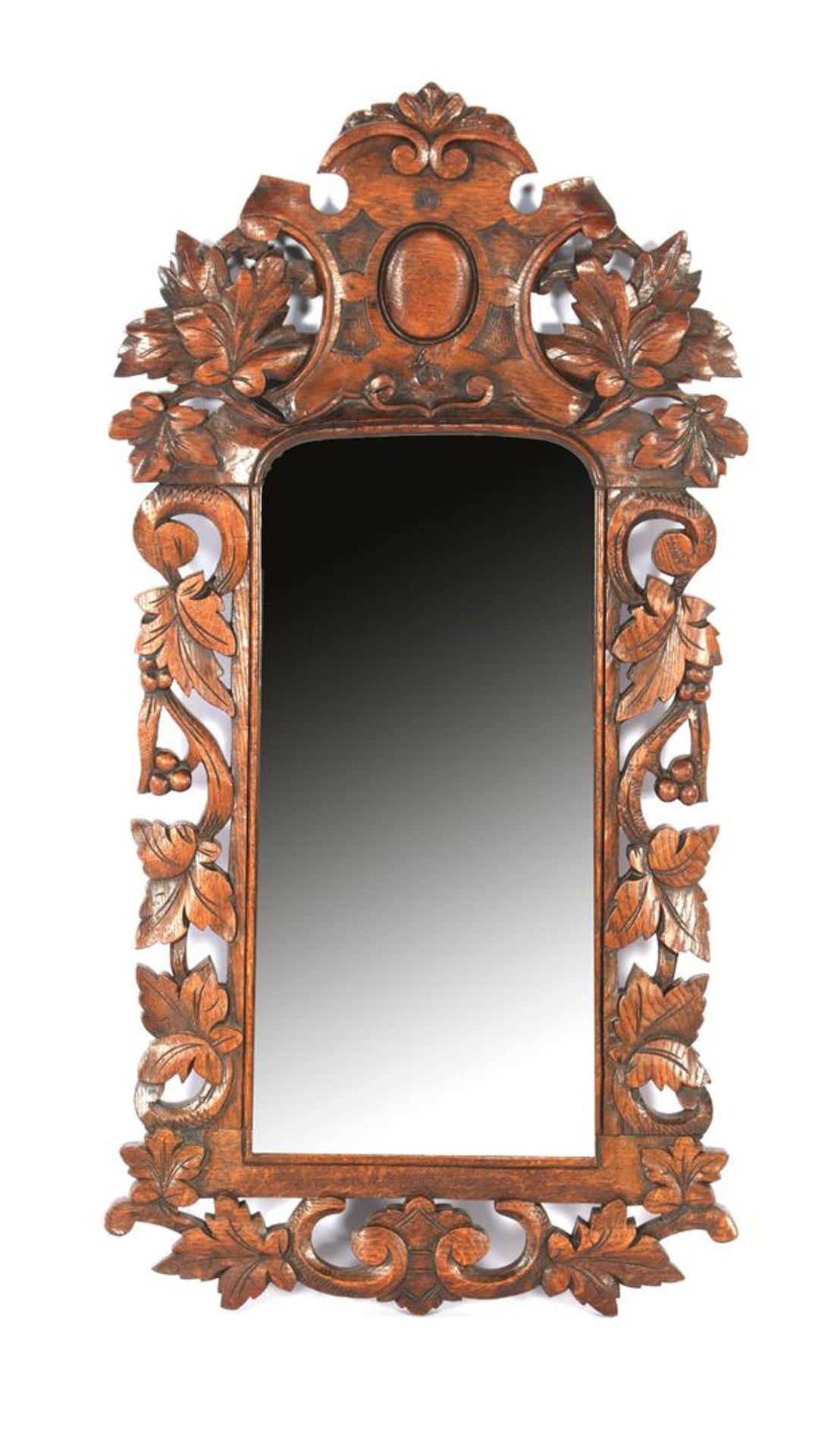 Mirror in oak richly decorated frame