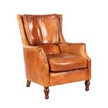 Brown leather arm chair on walnut legs